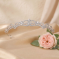 Preview: Tiara mit schönen Ornamenten - elegante Krone für Mädchen mit Strasssteinchen